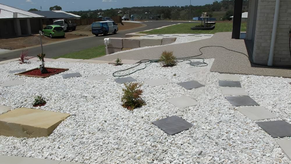 A Garden With a Lot of White Gravel and Plants — Highfields Landscape Supplies In Meringandan, QLD