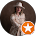 A woman in a cowboy hat is standing in a circle next to an orange star.