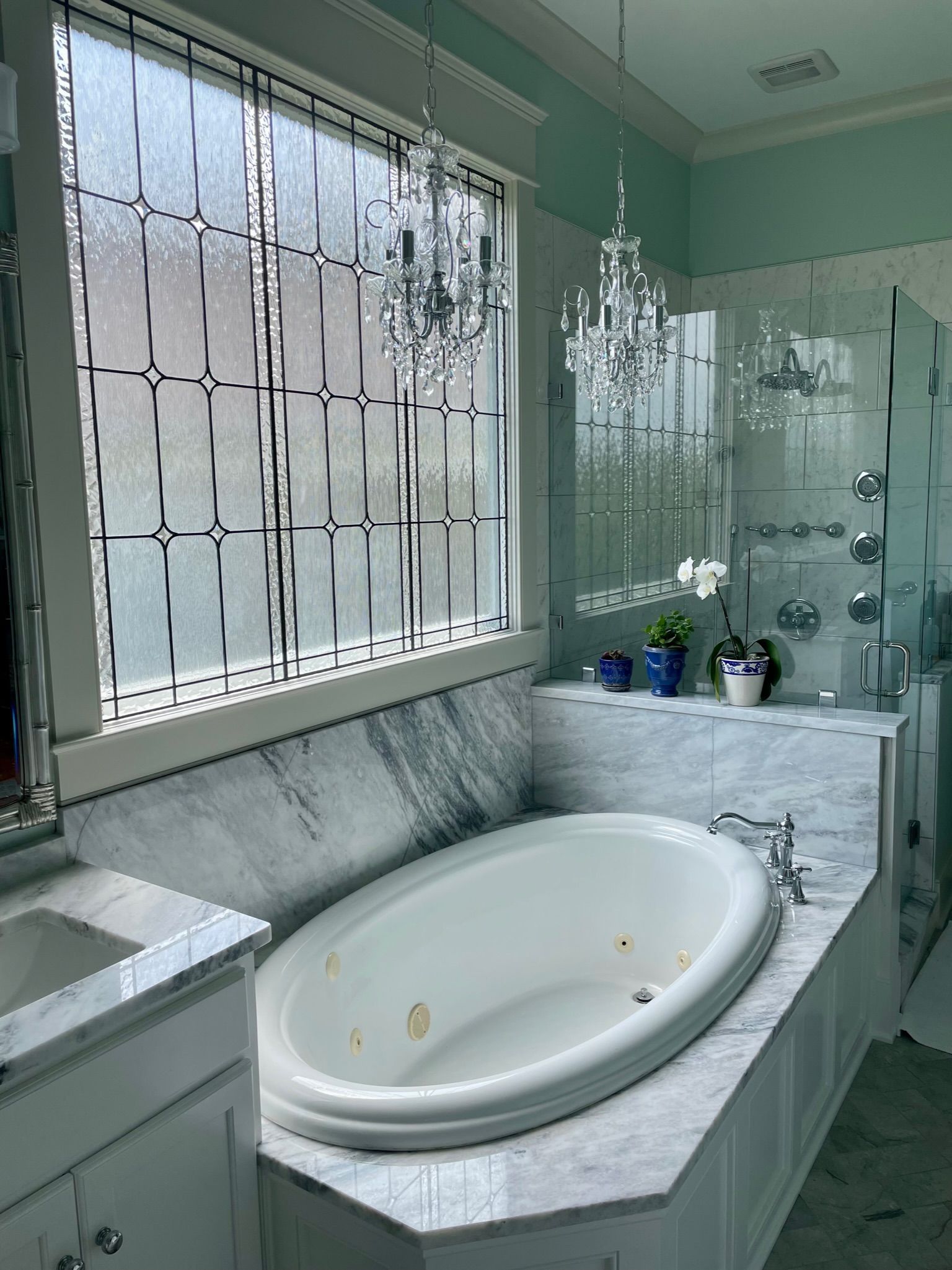 A bathroom with a bathtub and a window