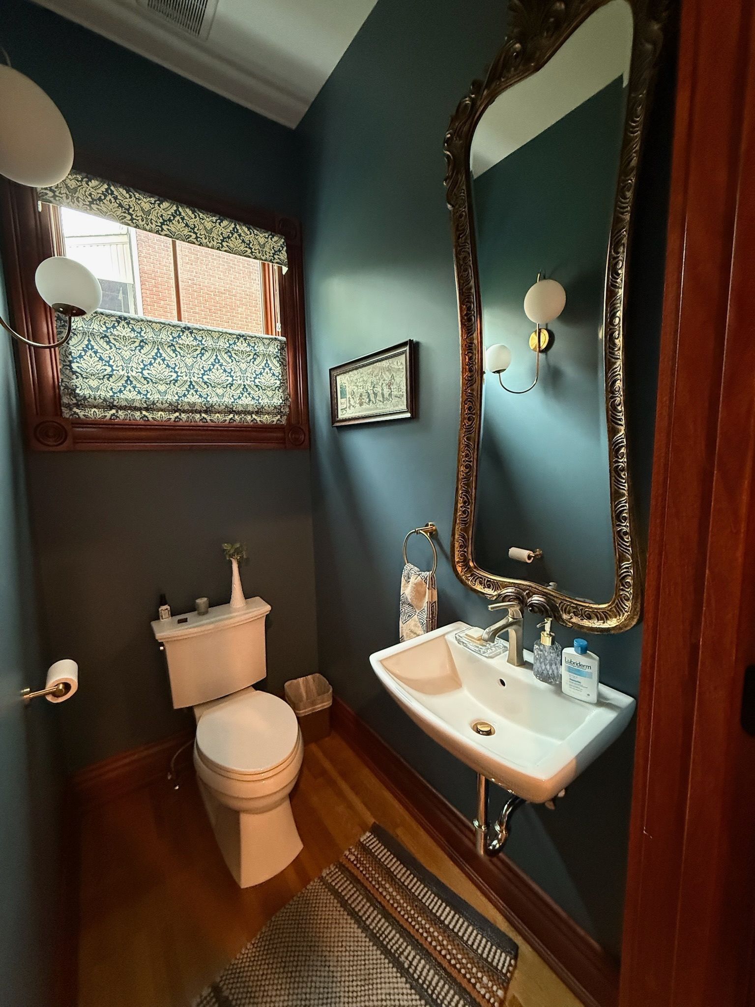 Luxury marble bathroom with freestanding tub and glass shower enclosure.