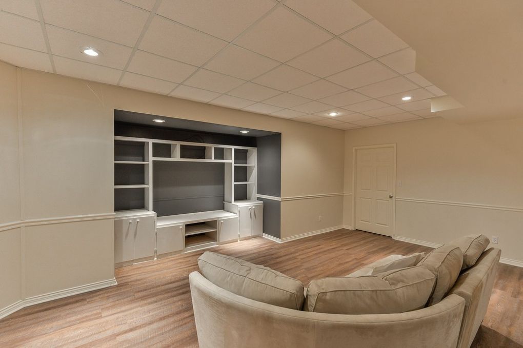 A living room with a couch and a television.