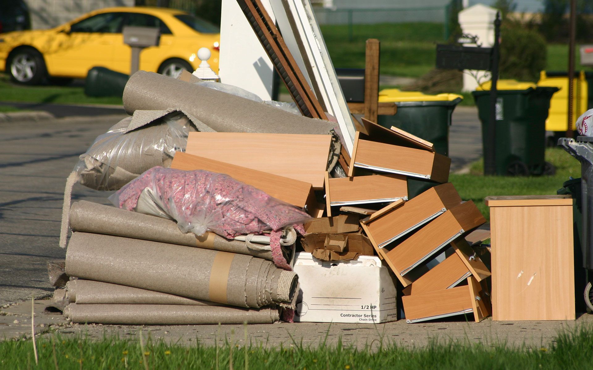 A pile of junk is sitting on the side of the road