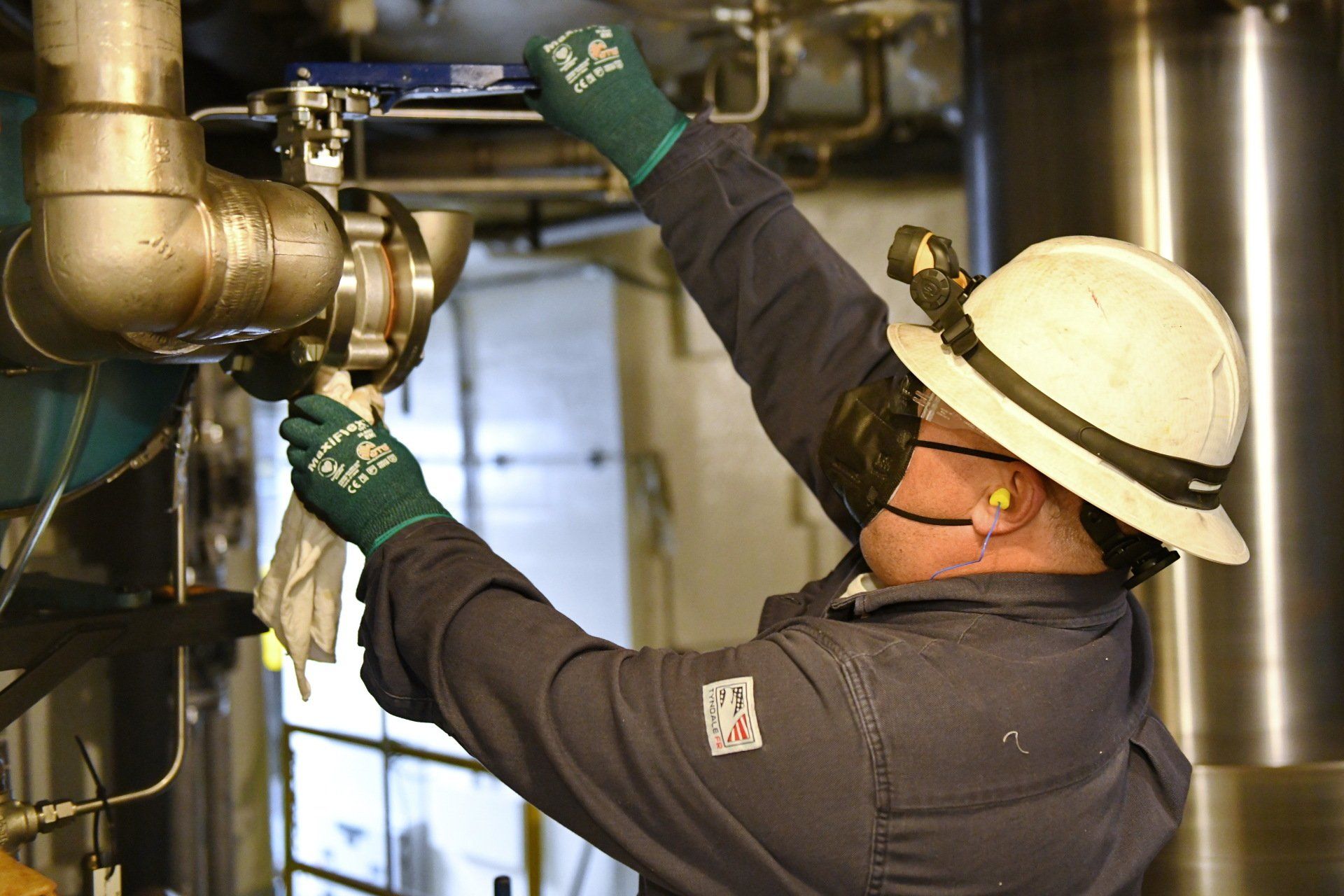 Local 538 apprentice fitting a pipe at Local 538 training hall after receiving industry certifications to nail the job