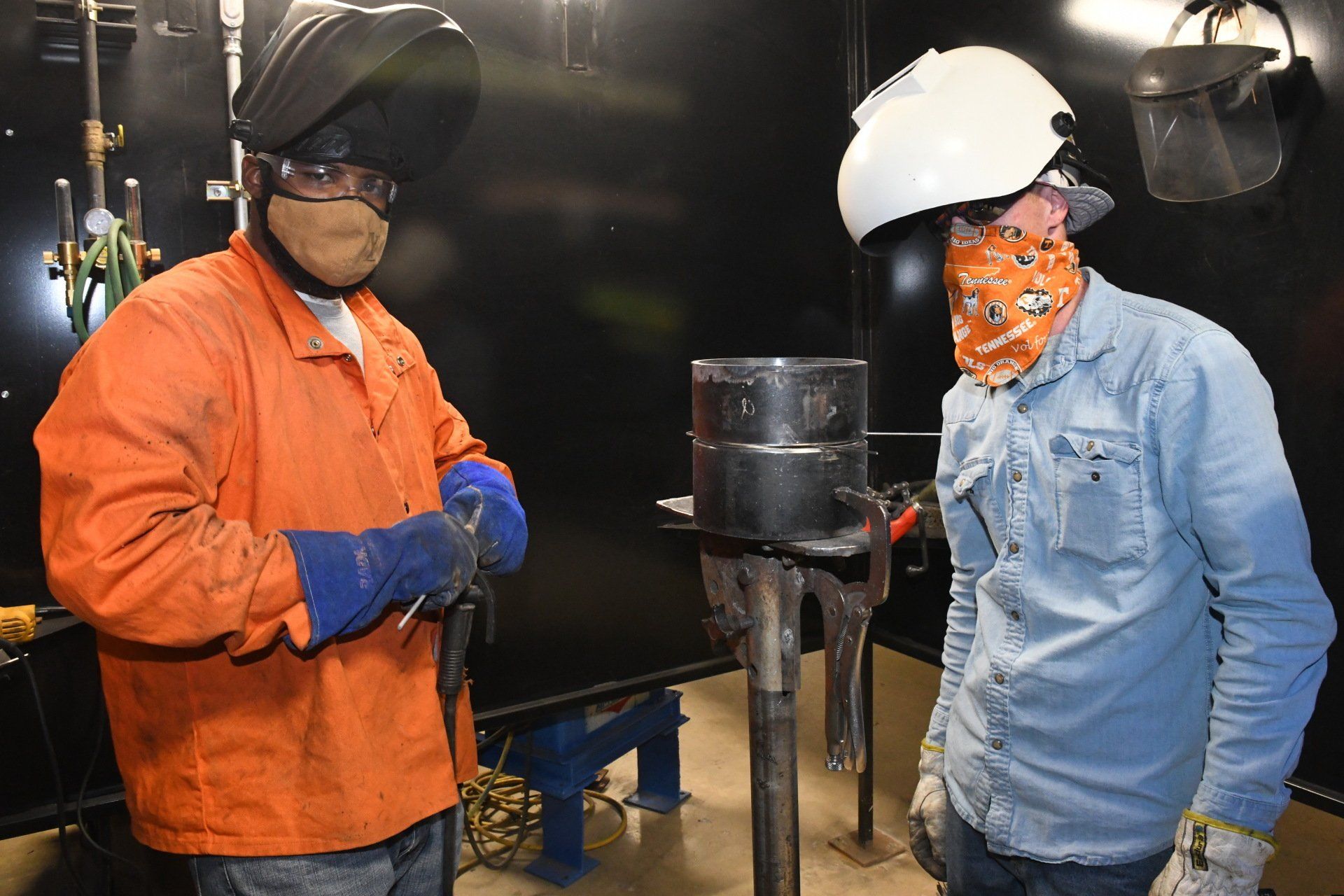 Local 538 Apprentices stick welding a pipe - 2-person job