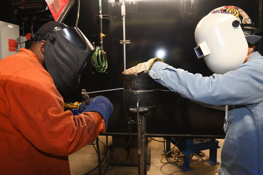 Local 538 Apprentices welding a unique machine for skilled laborers