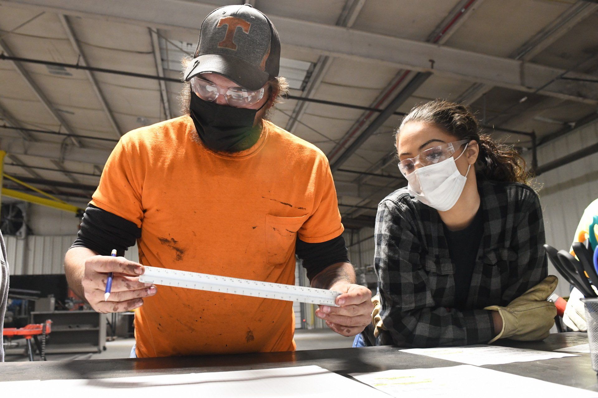 Local 538 Apprentices male & female measuring and planning