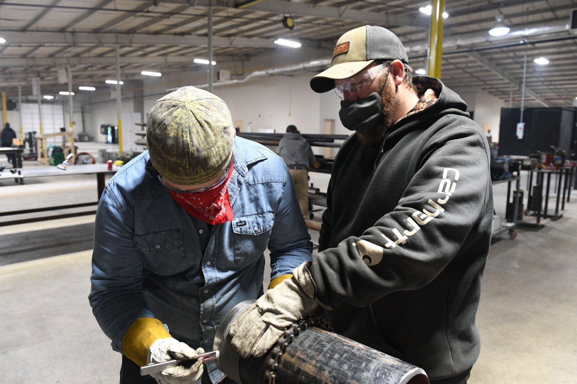 Two apprentices working on welding & pipefitting at UA Local 538 Training Center