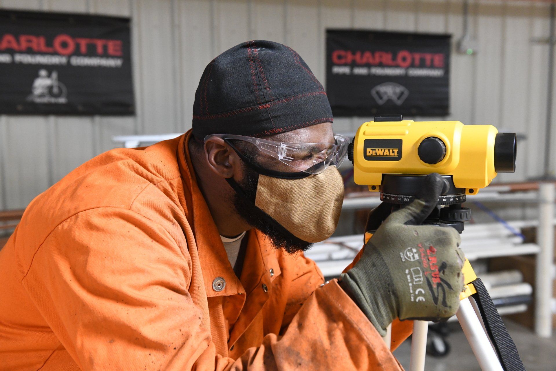 Local 538 Apprentice using a digital level