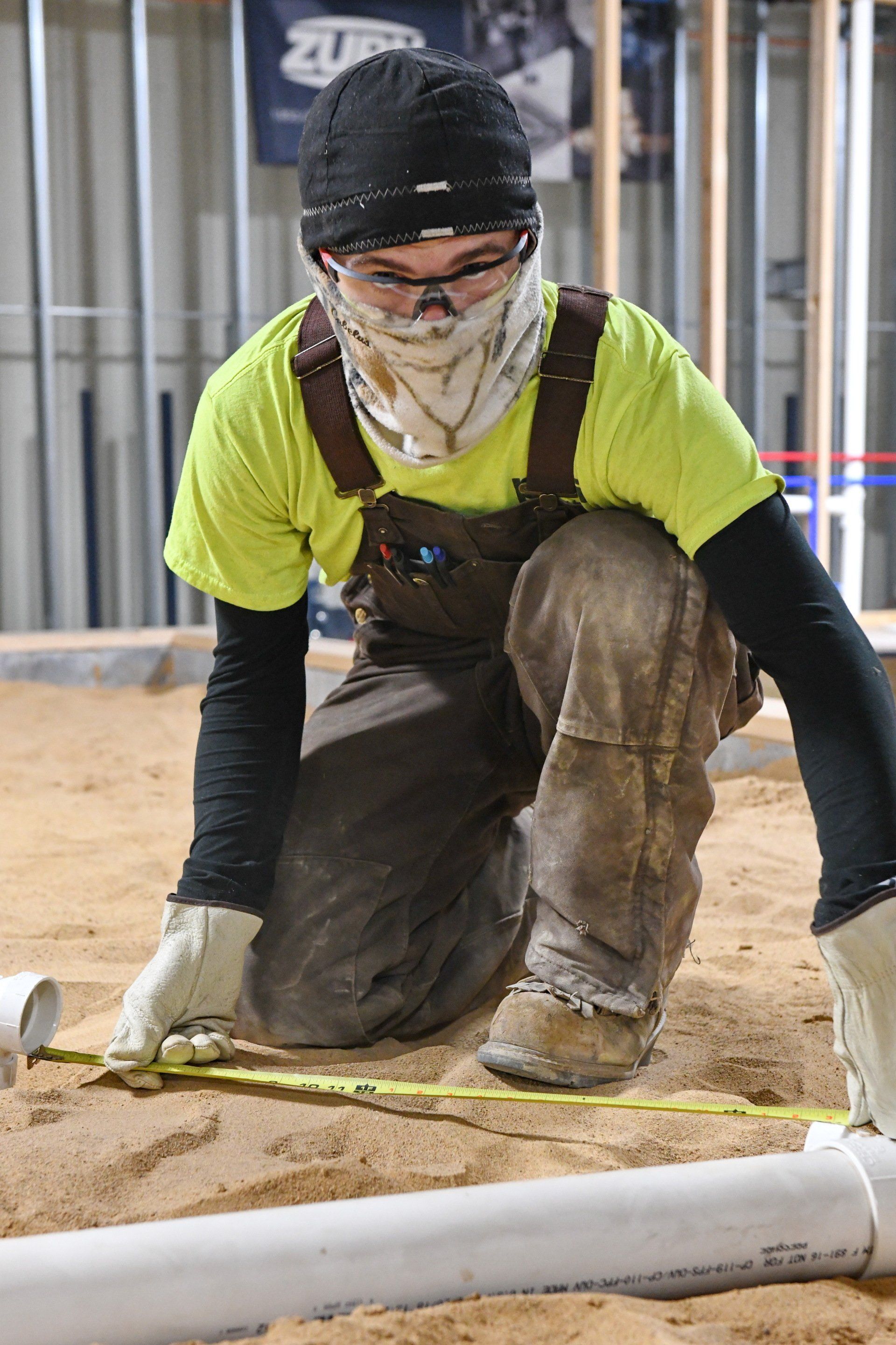 Local 538 Apprentice laying pipes underground