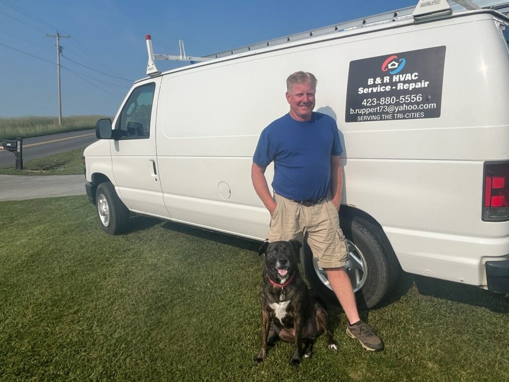 B&R HVAC Service & Repair Owner standing in from of his Van with his Dog smiling and posing for a shot