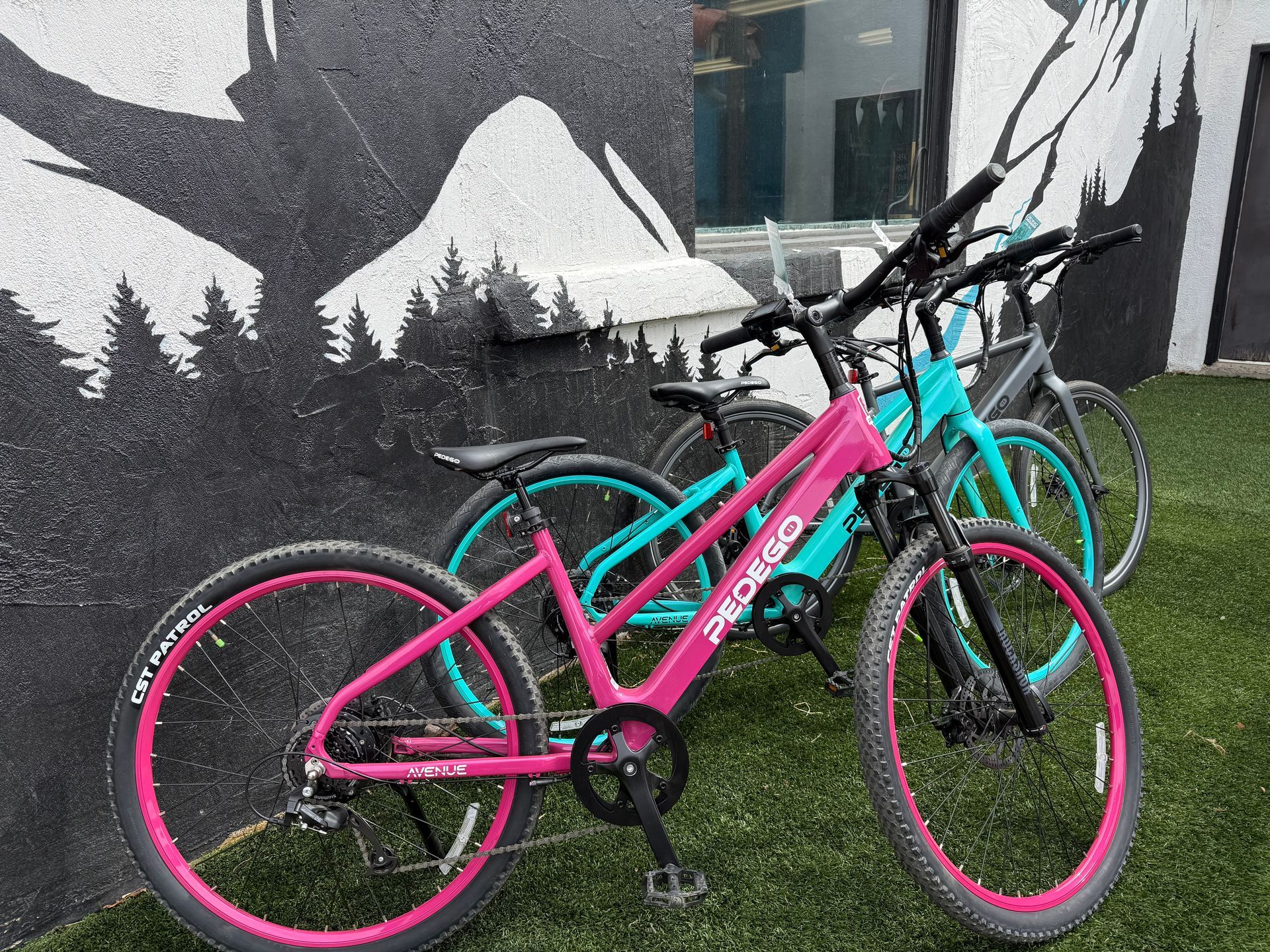 woman and man enjoying ebike ride down hill in crested butte