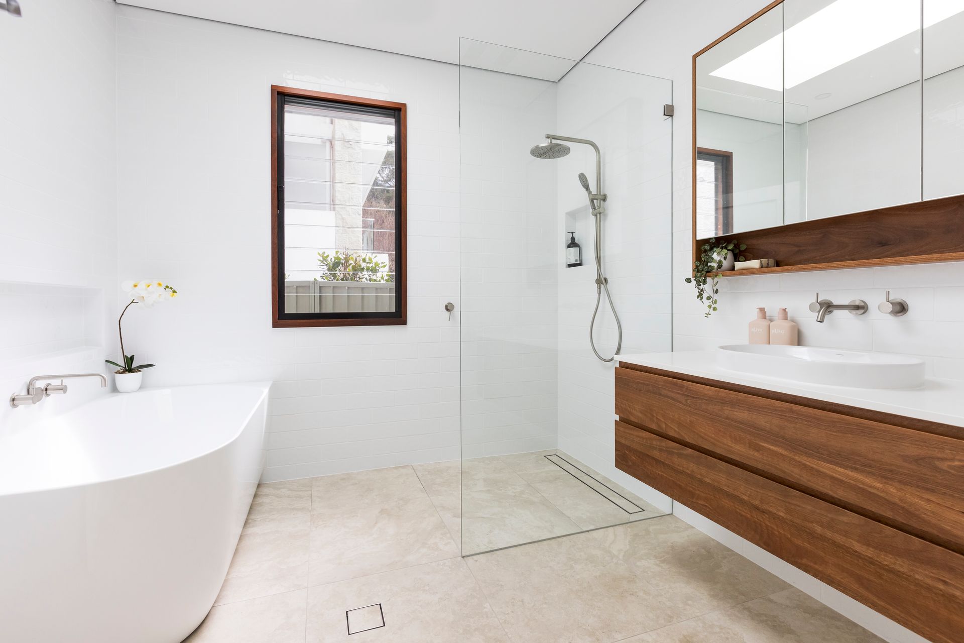 A White Bathroom With Shower and A Bath— Matt Loder Constructions in Bulli, NSW