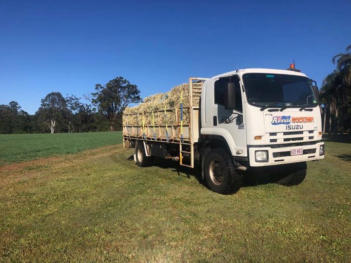 Aussie Rockmen Delivery Truck With Hay — Landscape Supplies In Carrara,QLD