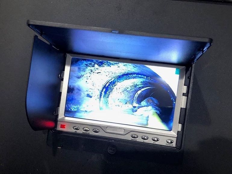 a monitor with a picture of a wave on it