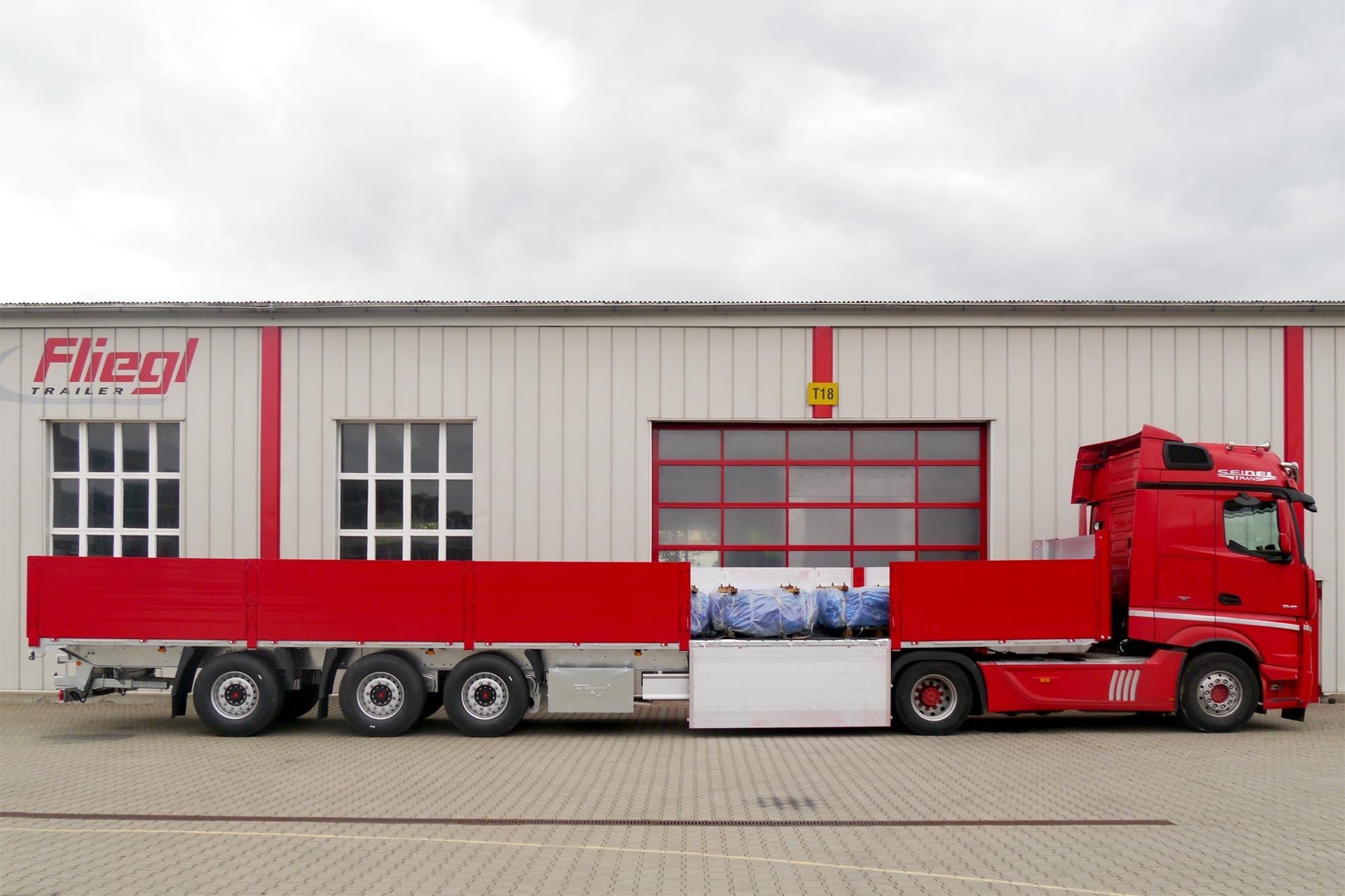 Fliegl bortinės puspriekabės