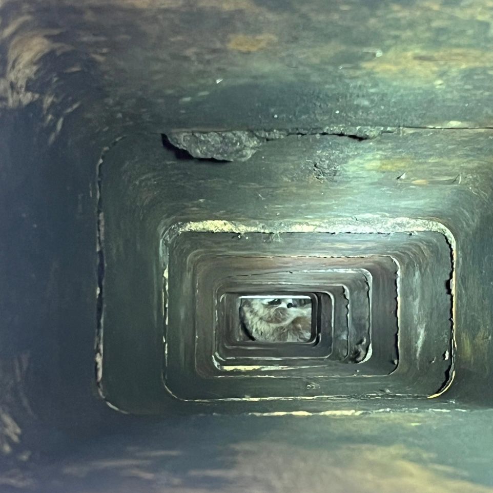 The inside of a tunnel with a few holes in it