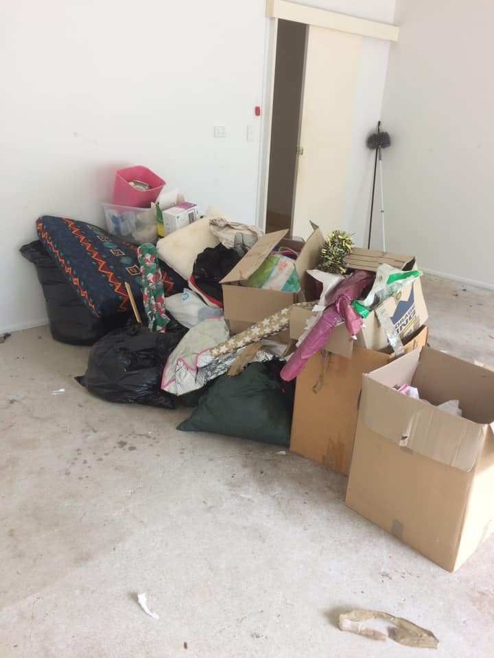 A Room With a Lot of Boxes and Bags on the Floor — A Load of Rubbish In Maroochydore, QLD