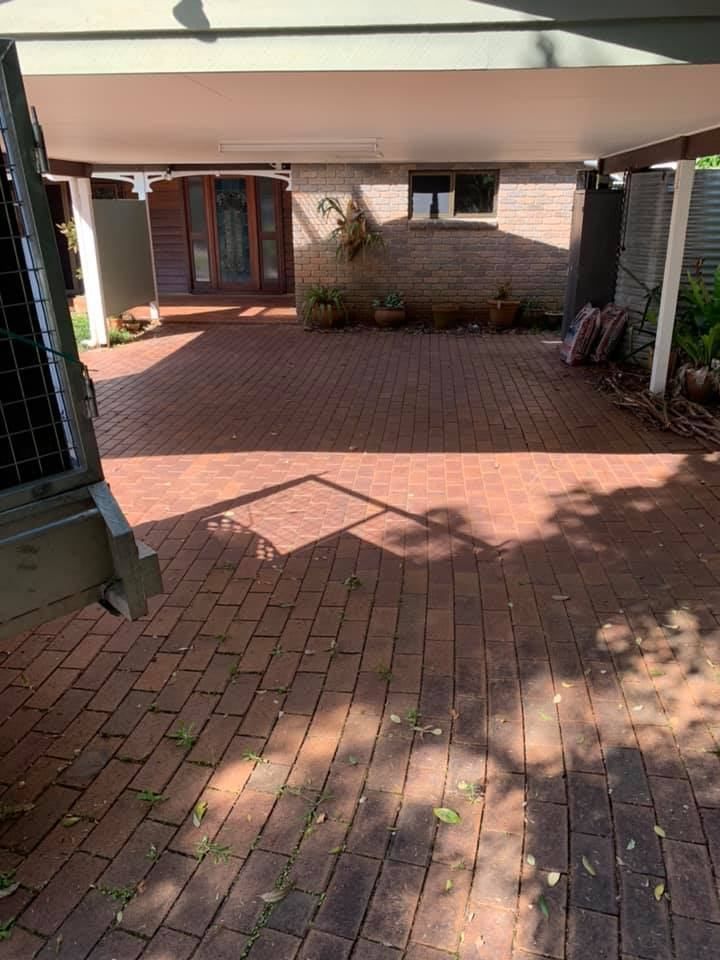 A Brick Driveway Leading to a House With a Canopy Over It — A Load of Rubbish In Buderim, QLD