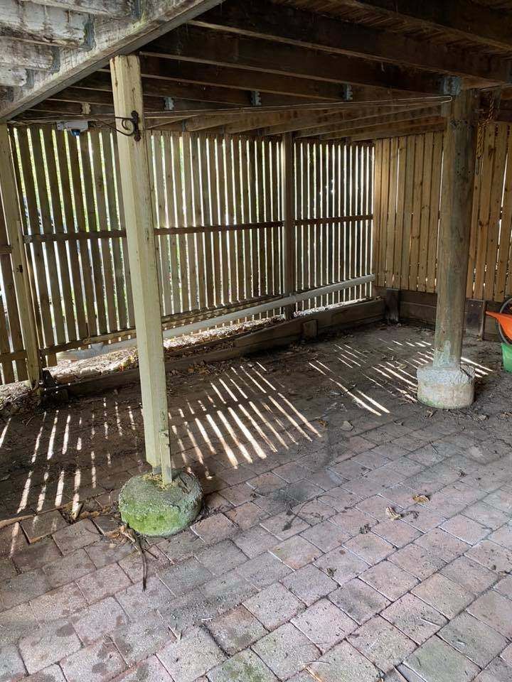 A Wooden Structure With a Brick Floor Underneath It — A Load of Rubbish In Buderim, QLD
