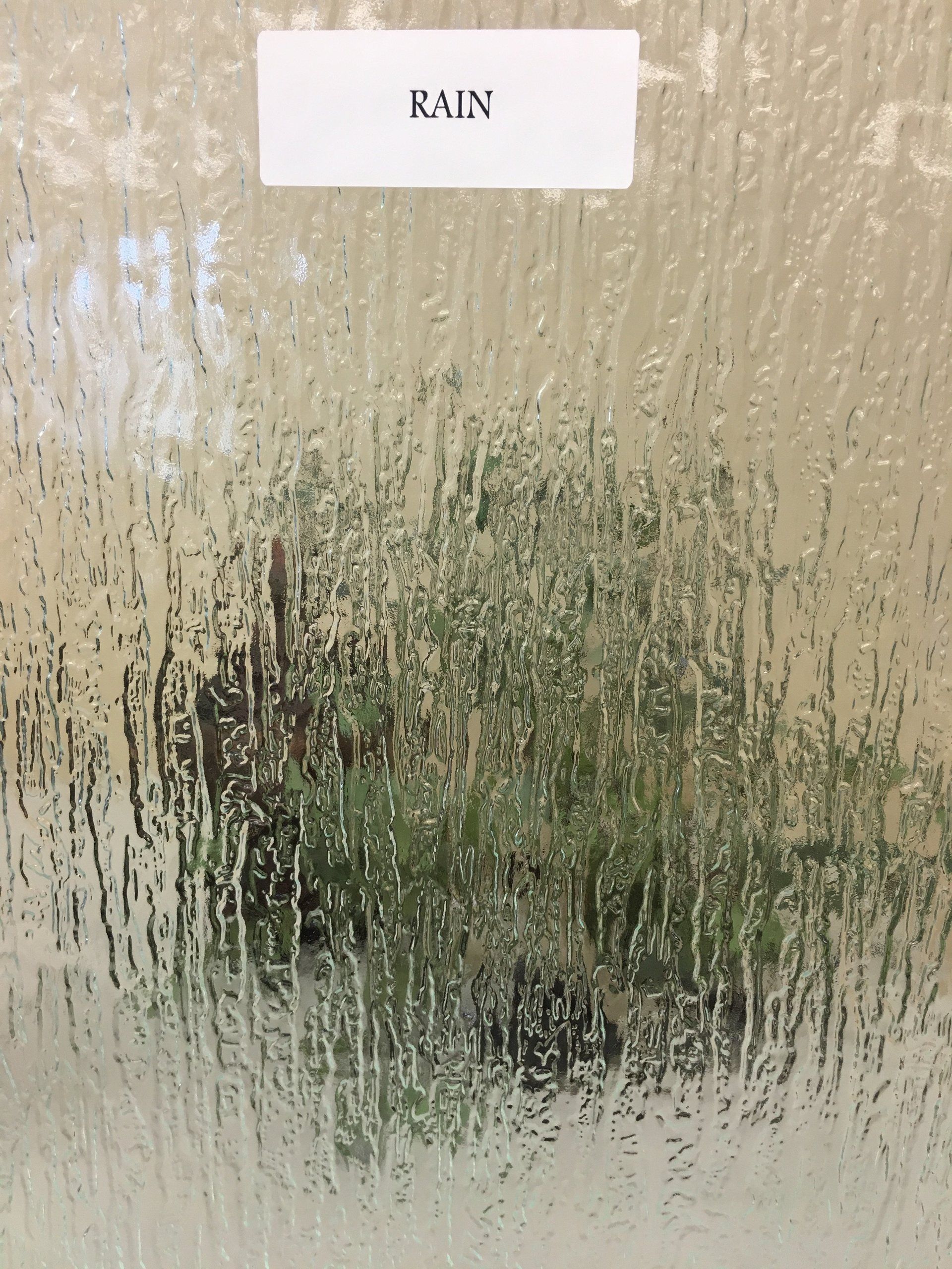 Rain-streaked glass pane with 