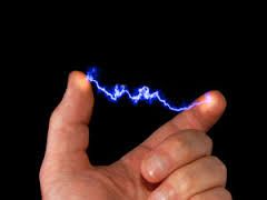 A Person Is Holding a Lightning Bolt on Their Finger — Alchemy Wellness Centre In Bangalow, NSW