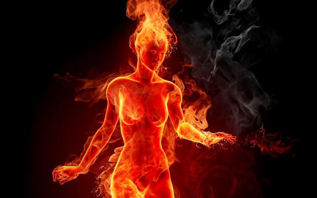 A Woman Is Surrounded by Flames on A Black Background — Alchemy Wellness Centre In Bangalow, NSW