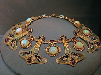 A Gold Necklace with Opal and Purple Stones — Alchemy Wellness Centre In Bangalow, NSW