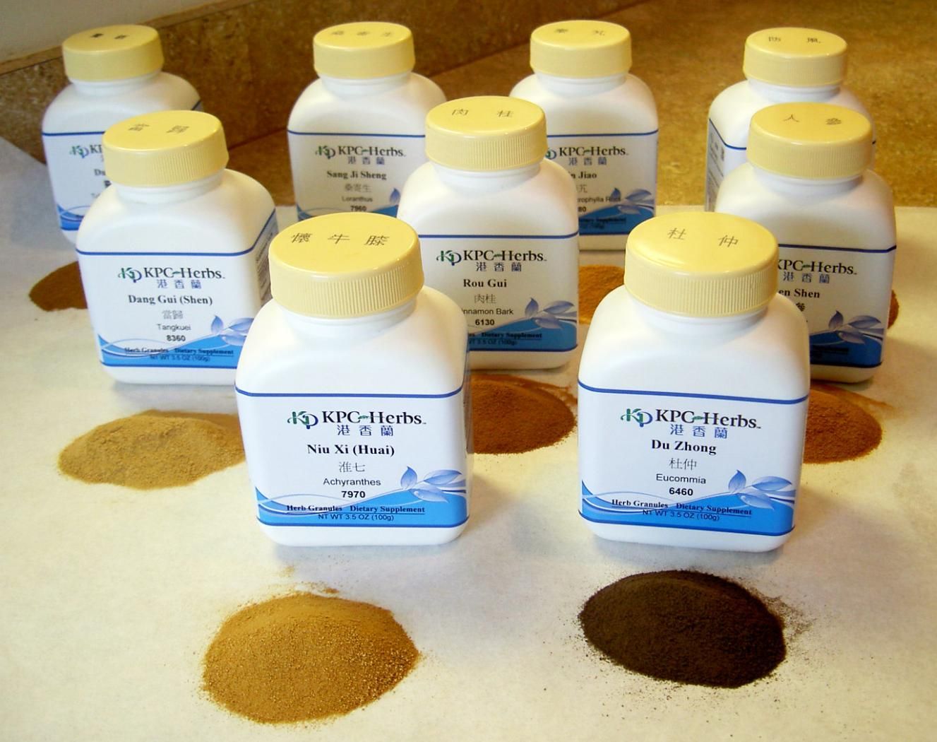 A Bunch of White Bottles with Blue and Yellow Labels that Say Hydro-Herbs — Alchemy Wellness Centre In Bangalow, NSW