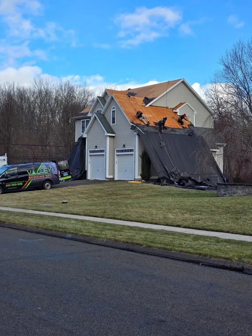 A house with a roof that is being repaired