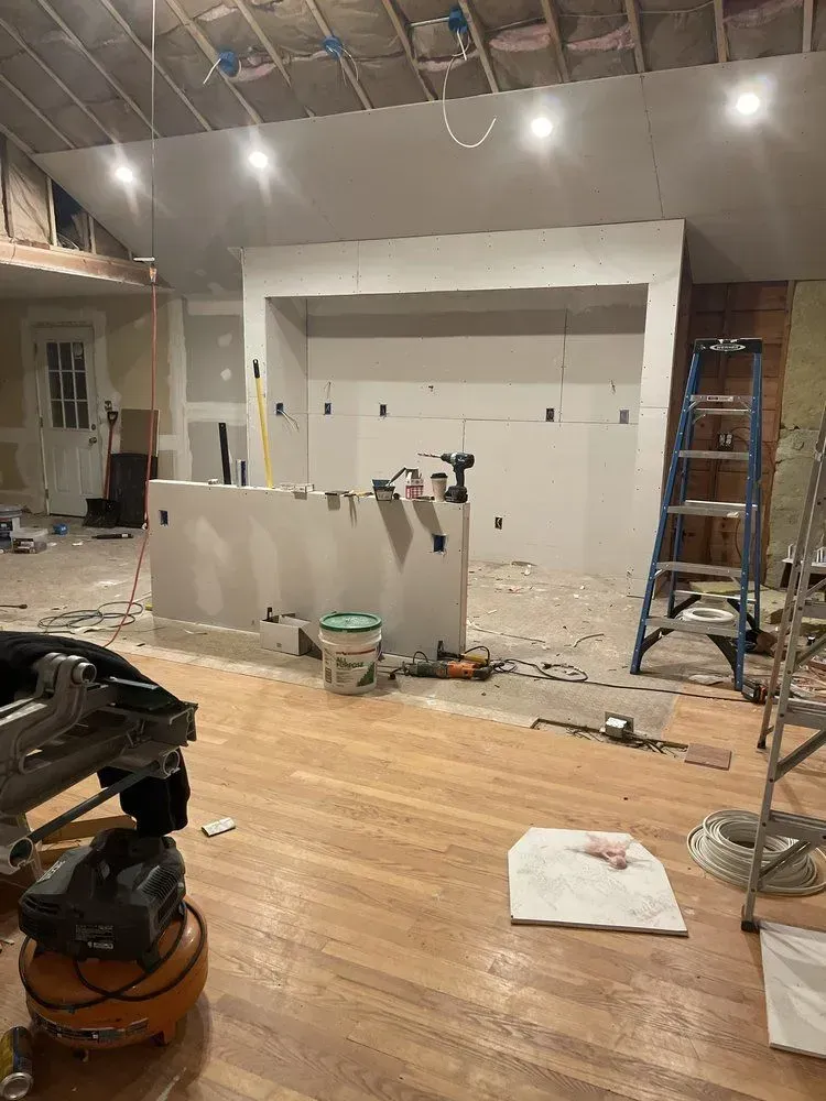 A room that is being remodeled with a lot of tools on the floor.