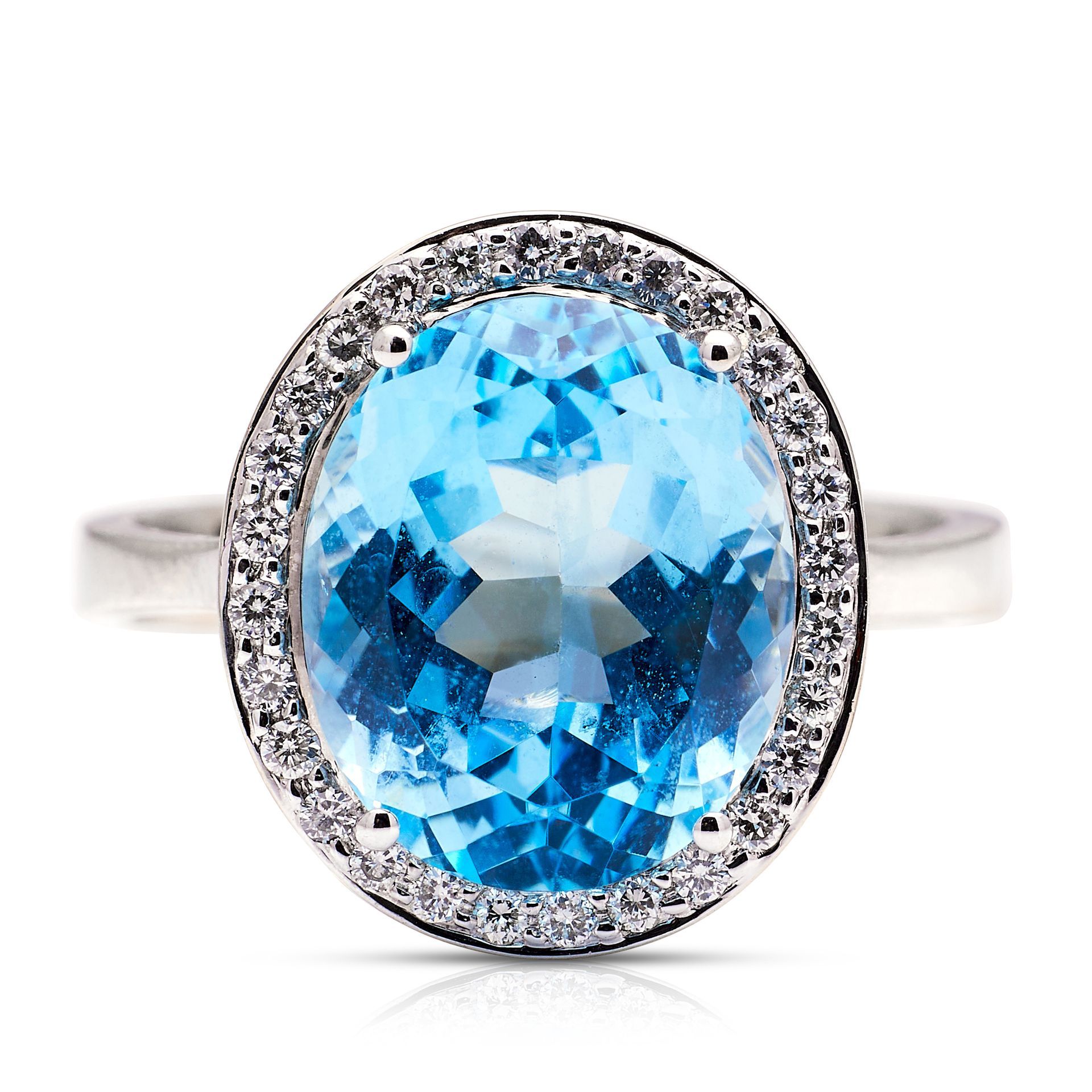 a ring with a blue stone and diamonds on a white background