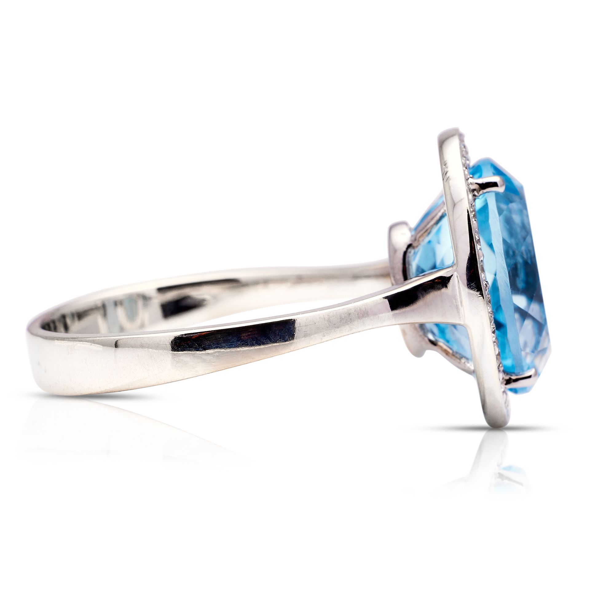 a silver ring with a blue stone in the center