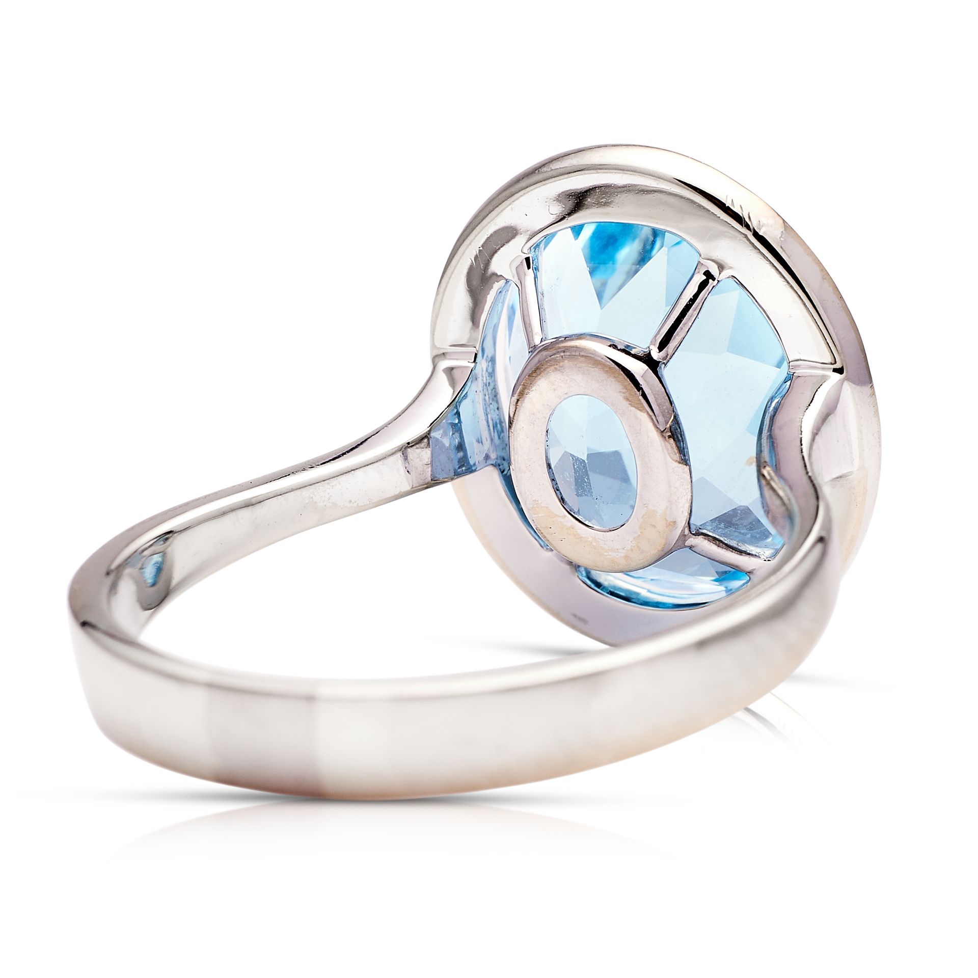 a silver ring with a blue stone in the center