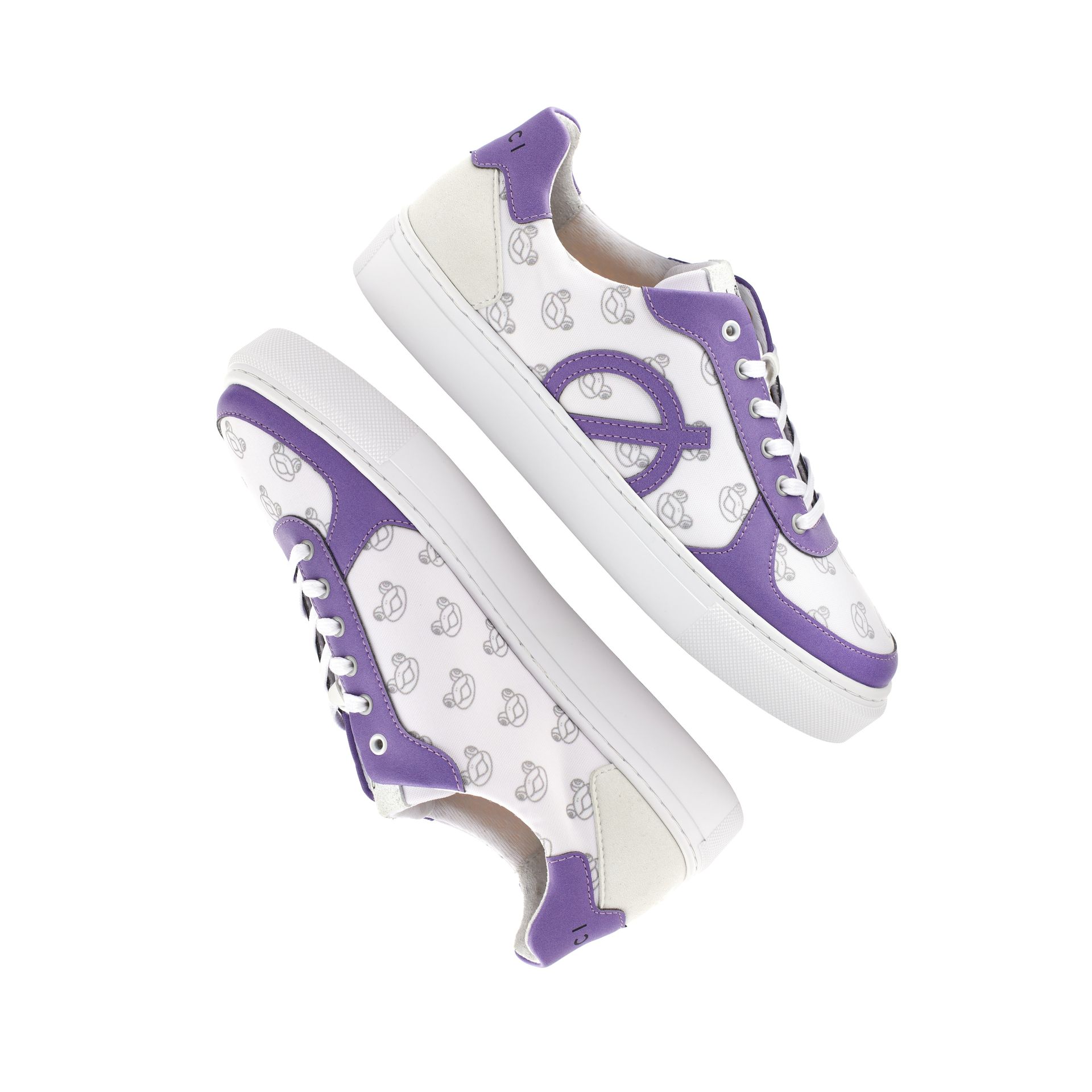 a pair of white and purple sneakers on a white background .