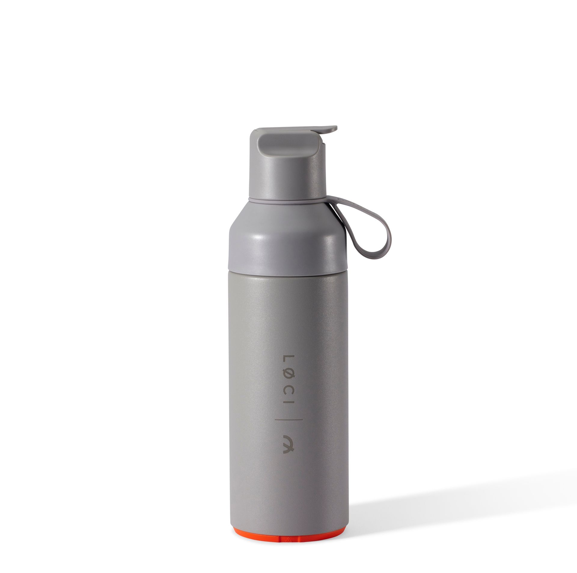 a gray water bottle with a handle on a white background .