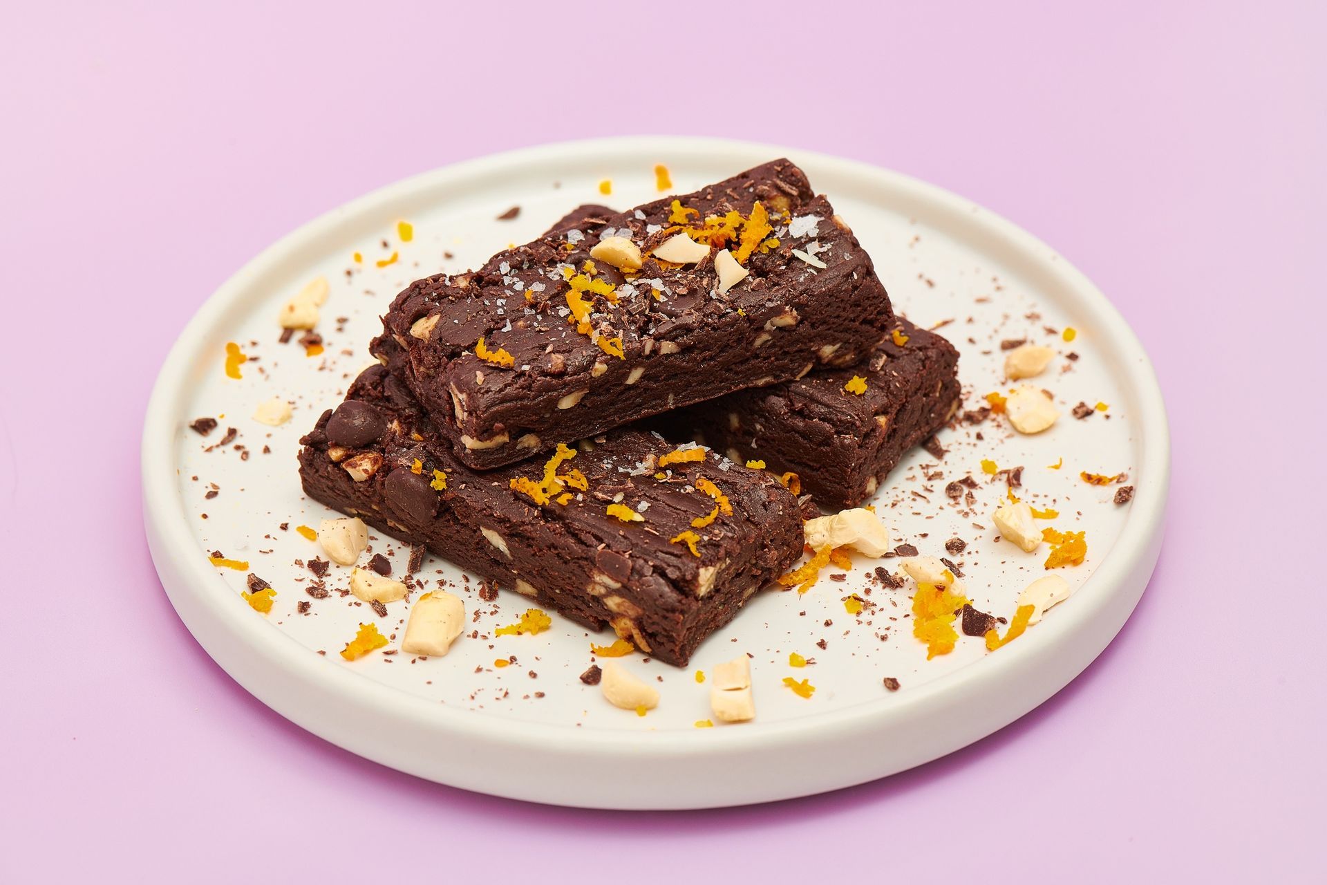 an orange water bottle with a handle on a white background