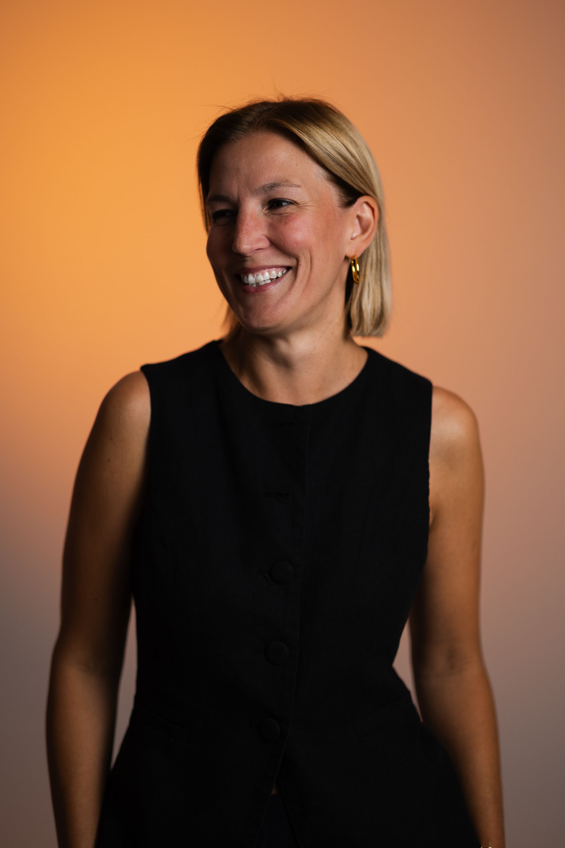 a woman is wearing a blue sweatshirt with a leopard and flowers on it .