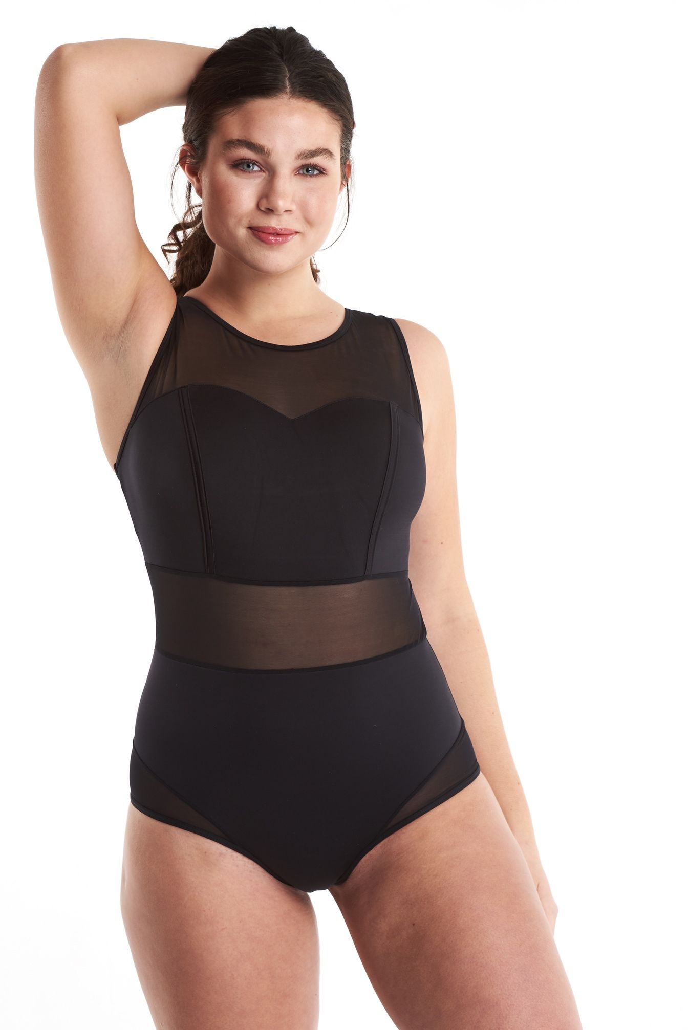 a woman in a black swimsuit is standing on a white background .