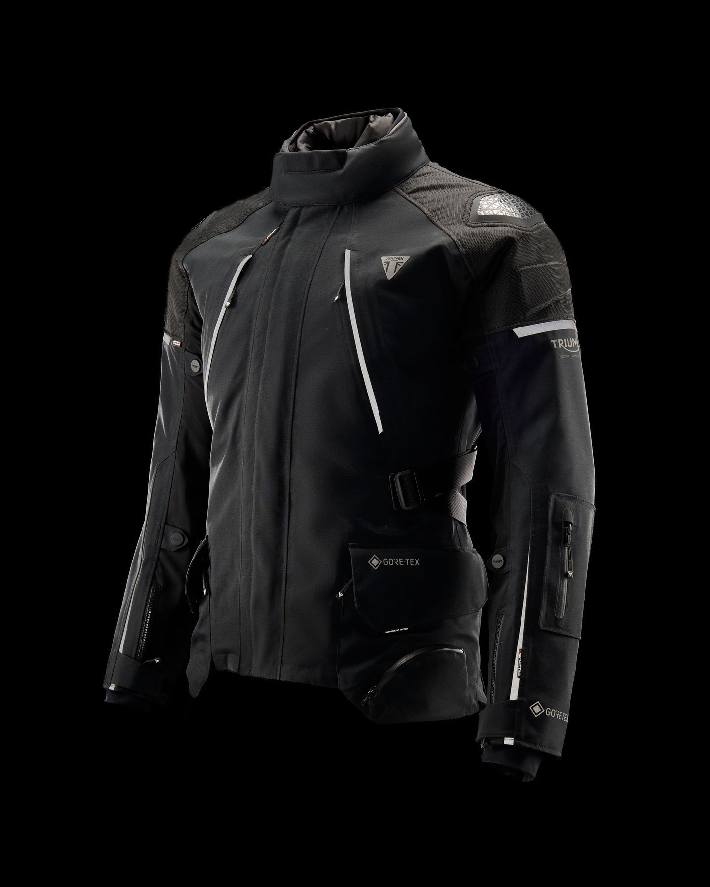 a black motorcycle jacket is on a mannequin on a black background .