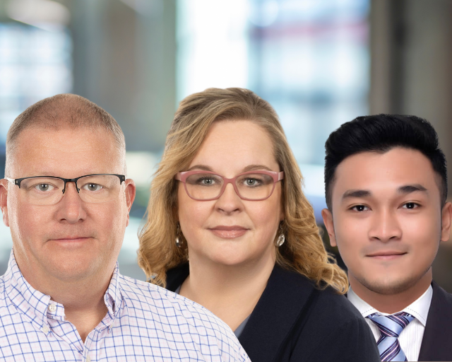 Three people smiling, posed in a professional setting.