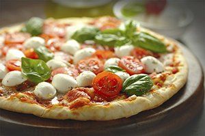 Freshly baked tomato and mozzarella pizza- San Vito Restaurant in Bayonne NJ