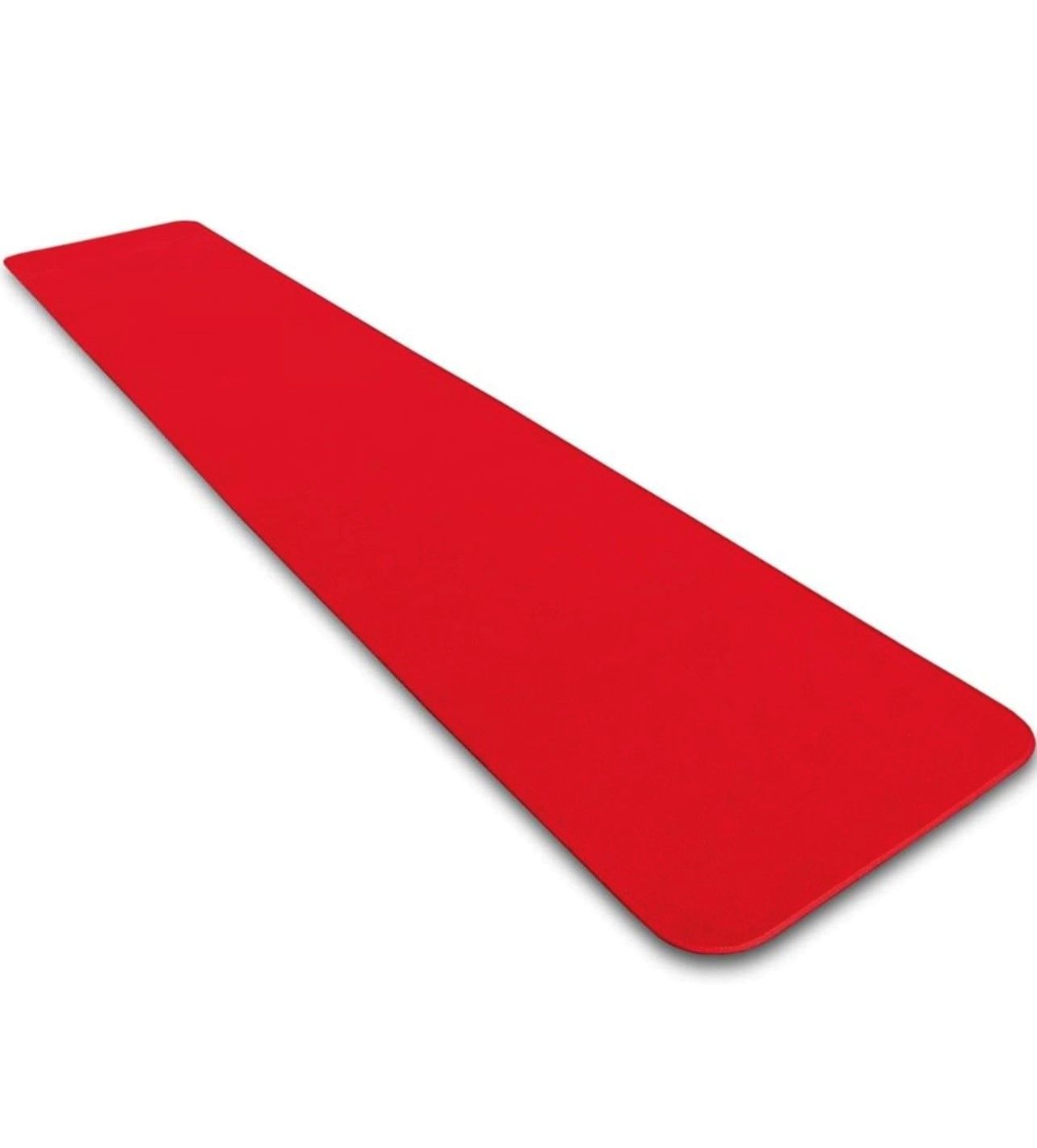 A long red carpet is laying on a white surface
