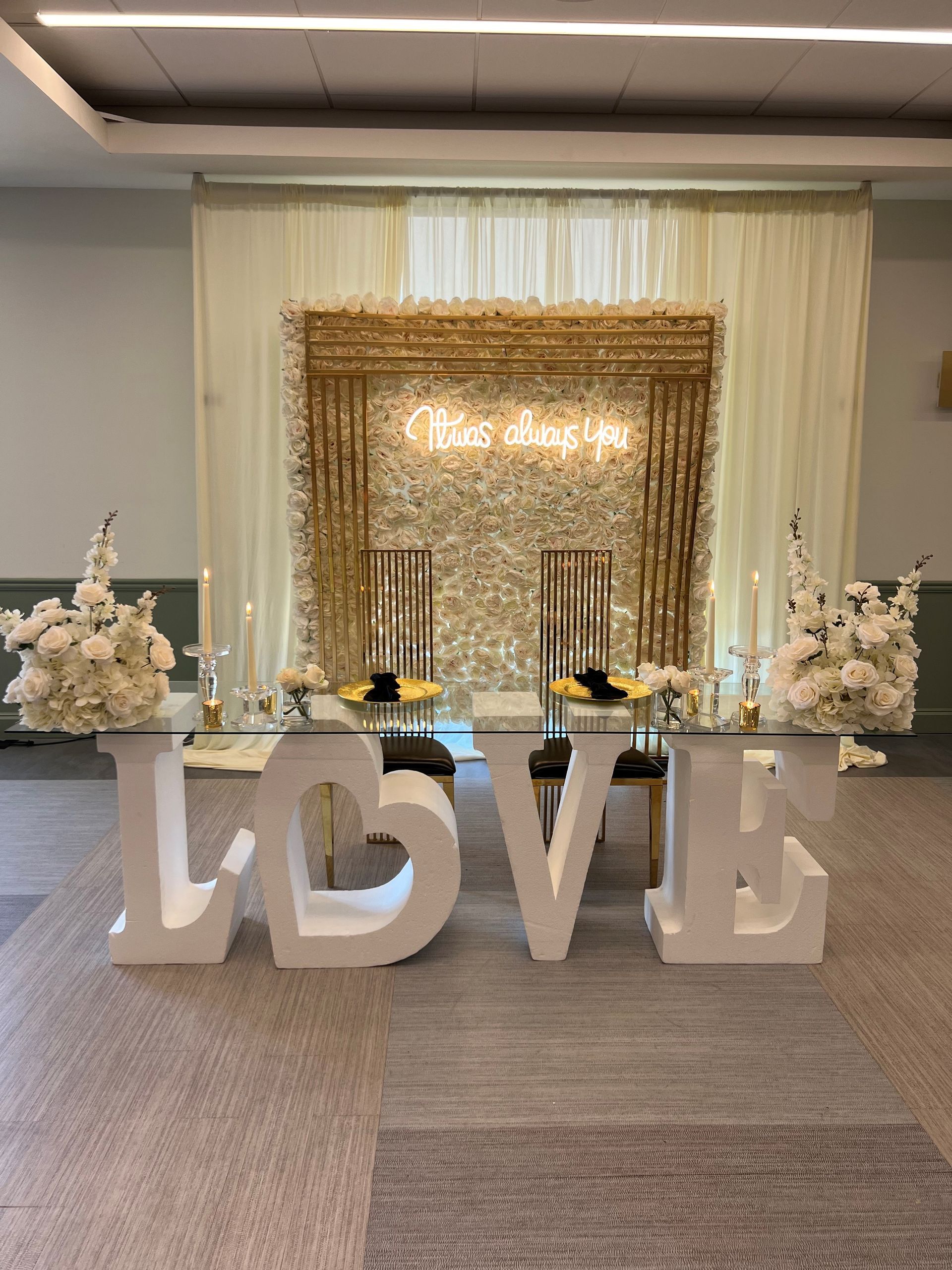 A room filled with signs and a photo booth.