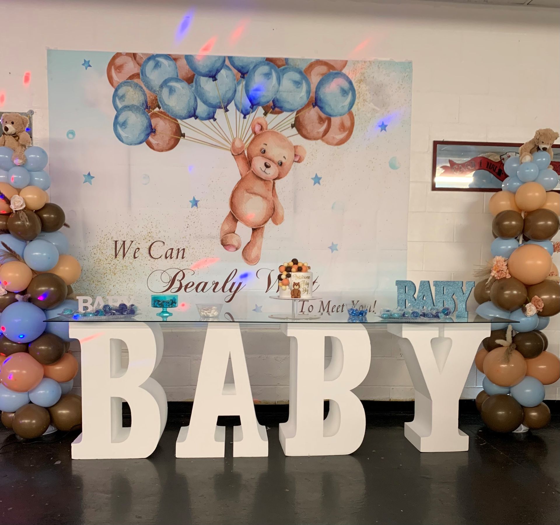 A room filled with signs and a ring light.