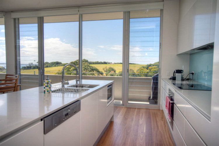 Seascape 1 House Kitchen View to Balcony- Barry Pfister Builder In Forster, NSW