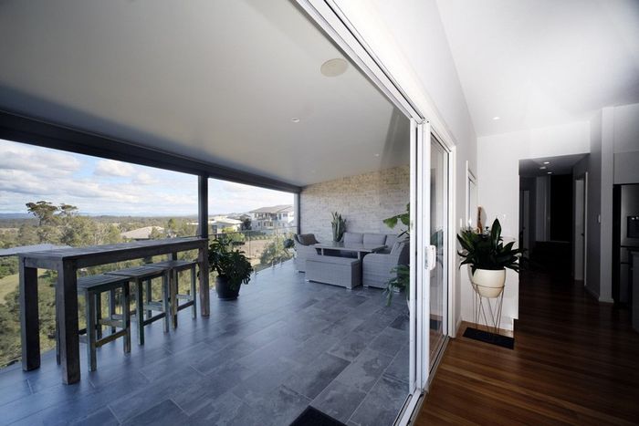 Living Room Doors Open to Balcony — Builders In Forster, NSW