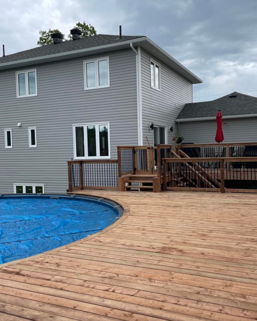 A large house with a swimming pool in front of it