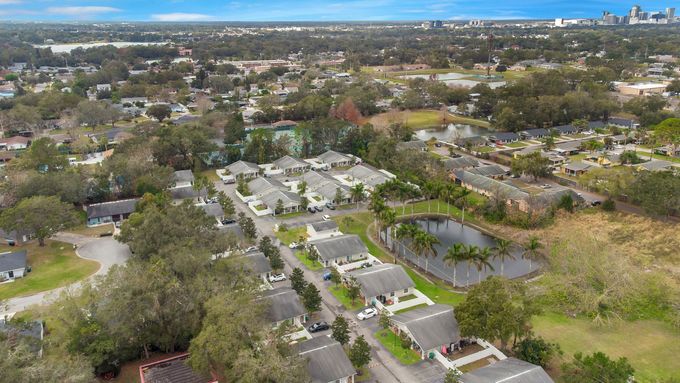 An aerial view of a residential area with lots of houses and trees.