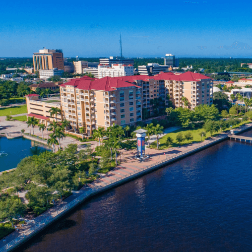 An aerial view of a city near a body of water