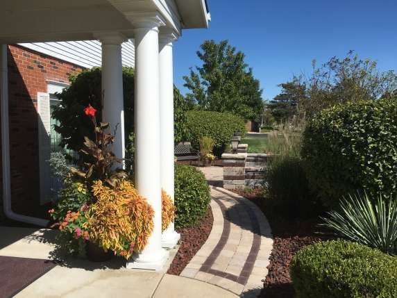 A brick house with a walkway leading to it